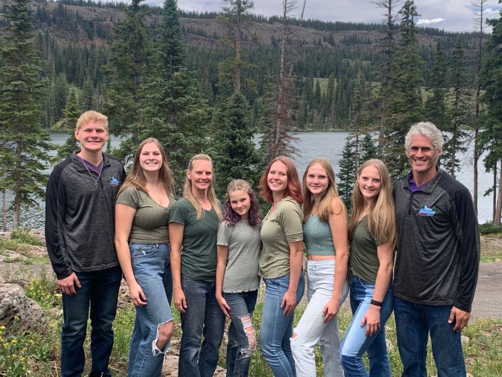 The Gilmore Family outdoors by the lake